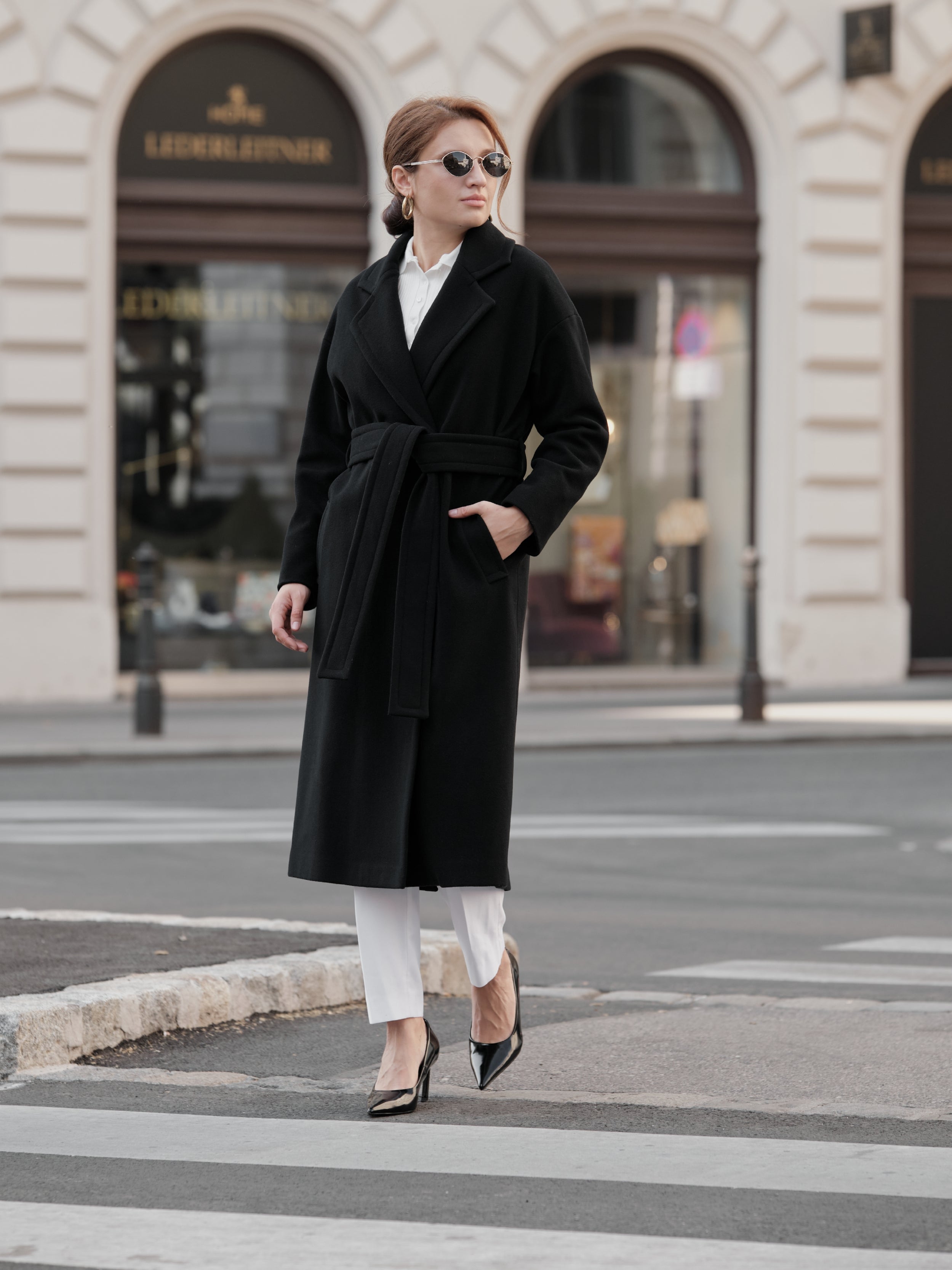 Women's Black Wool Coat with Model featuring a lapel collar